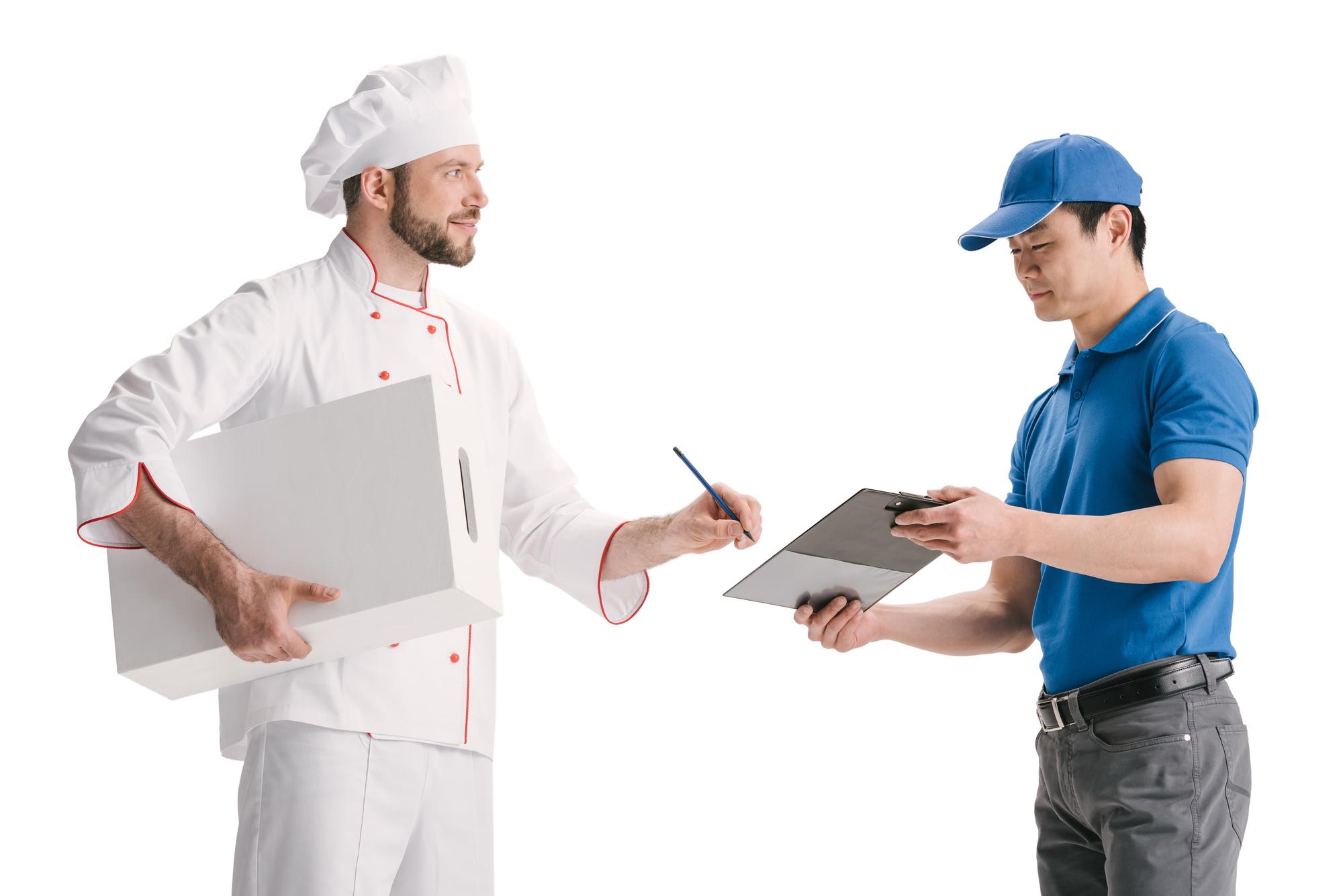 Chef handing meal kit to customer