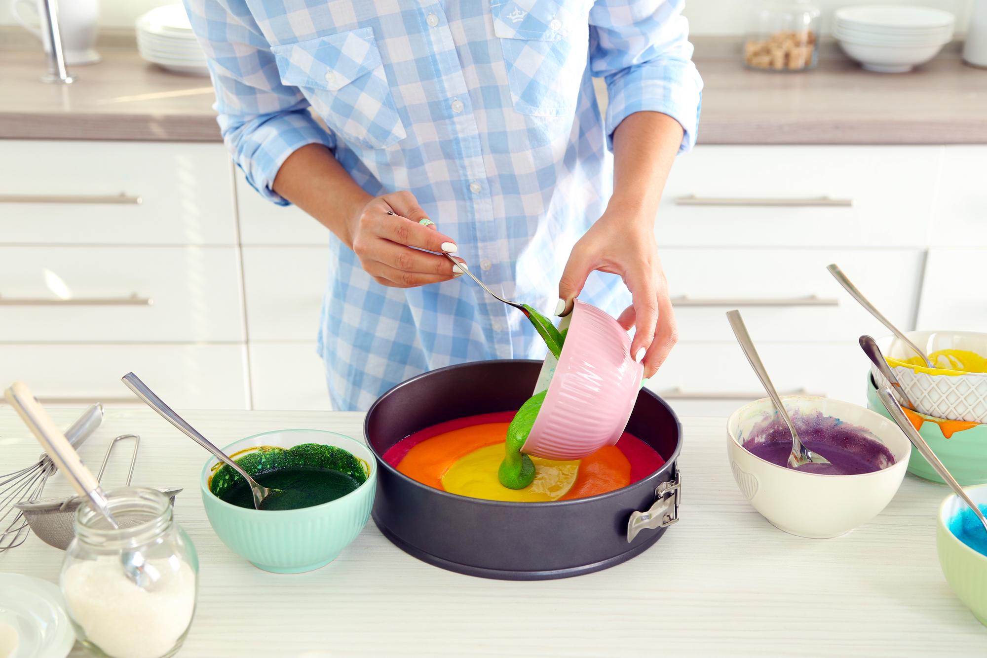 Person preparing colorful meal in a modern kitchen
